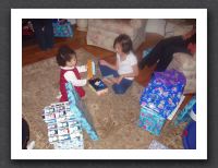Kayla and Gabrielle open presents