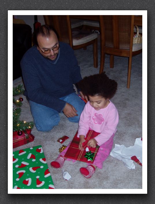 Kayla and Daddy open presents