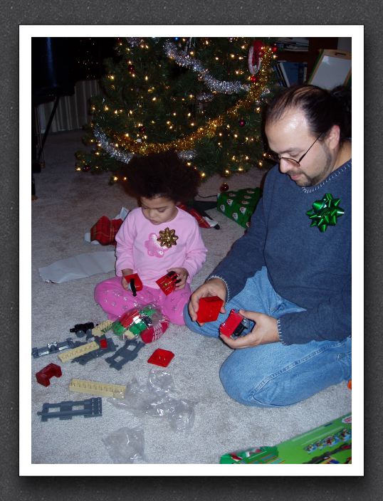Kayla and Daddy play with Lego trains