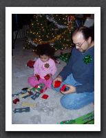 Kayla and Daddy play with Lego trains