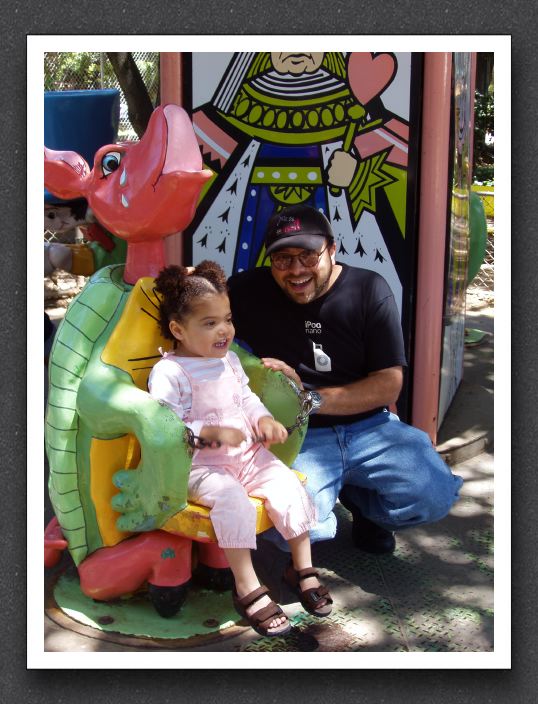 Kayla rides the Mock Turtle with Daddy