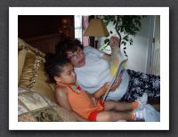 Nana reads to a tired Kayla