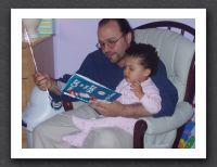 Daddy reads to Kayla