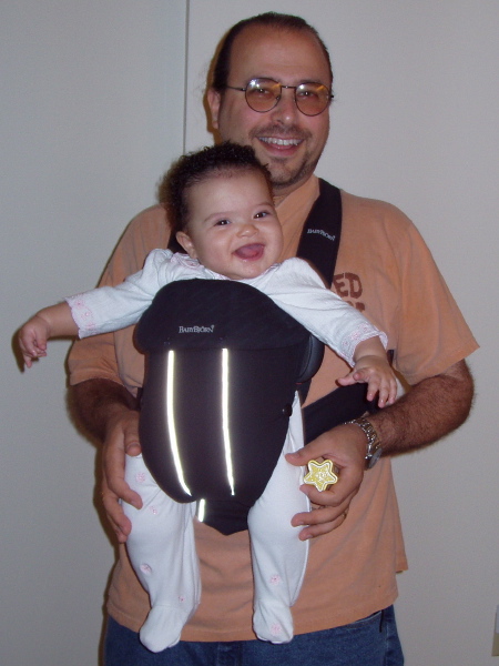 Daddy holds Kayla in the Bjorn