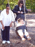 Mommy pushes Kayla in a Swing