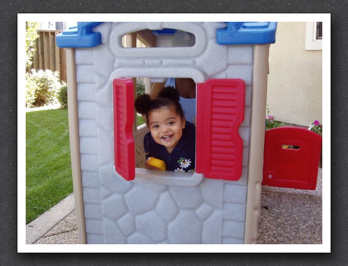 Kayla in her playhouse