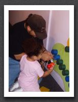 Kayla helps Daddy fix the exhibit