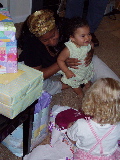 Rachel helps Kayla open her birthday presents